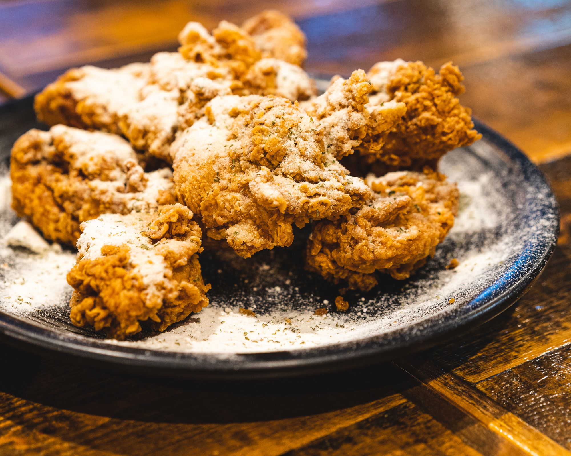 Korean fried chicken with a dusting of powder on-top