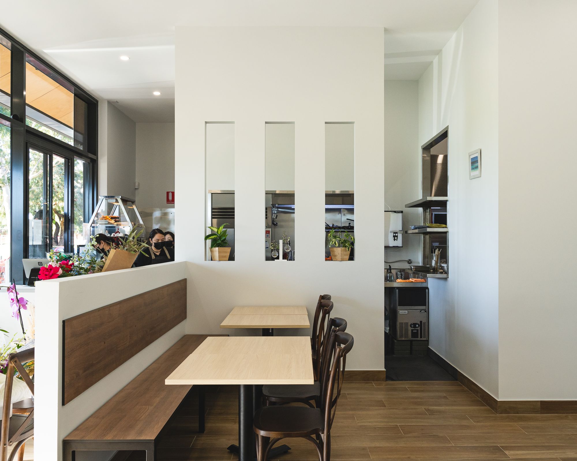 Interior of Arata Japanese Dining showing the open concept kitchen and dining chairs