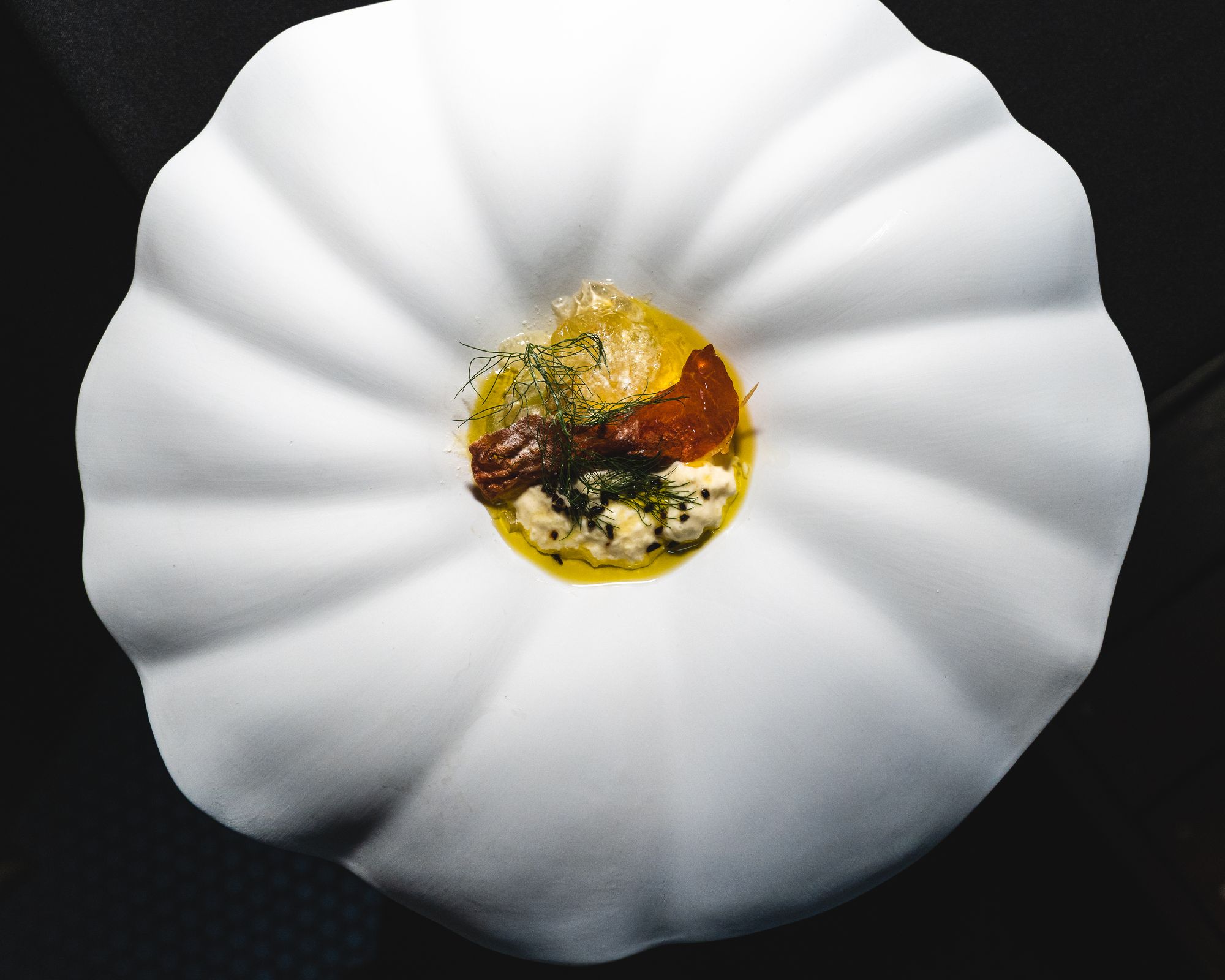 Flower shaped plate with fine dining dish in the middle