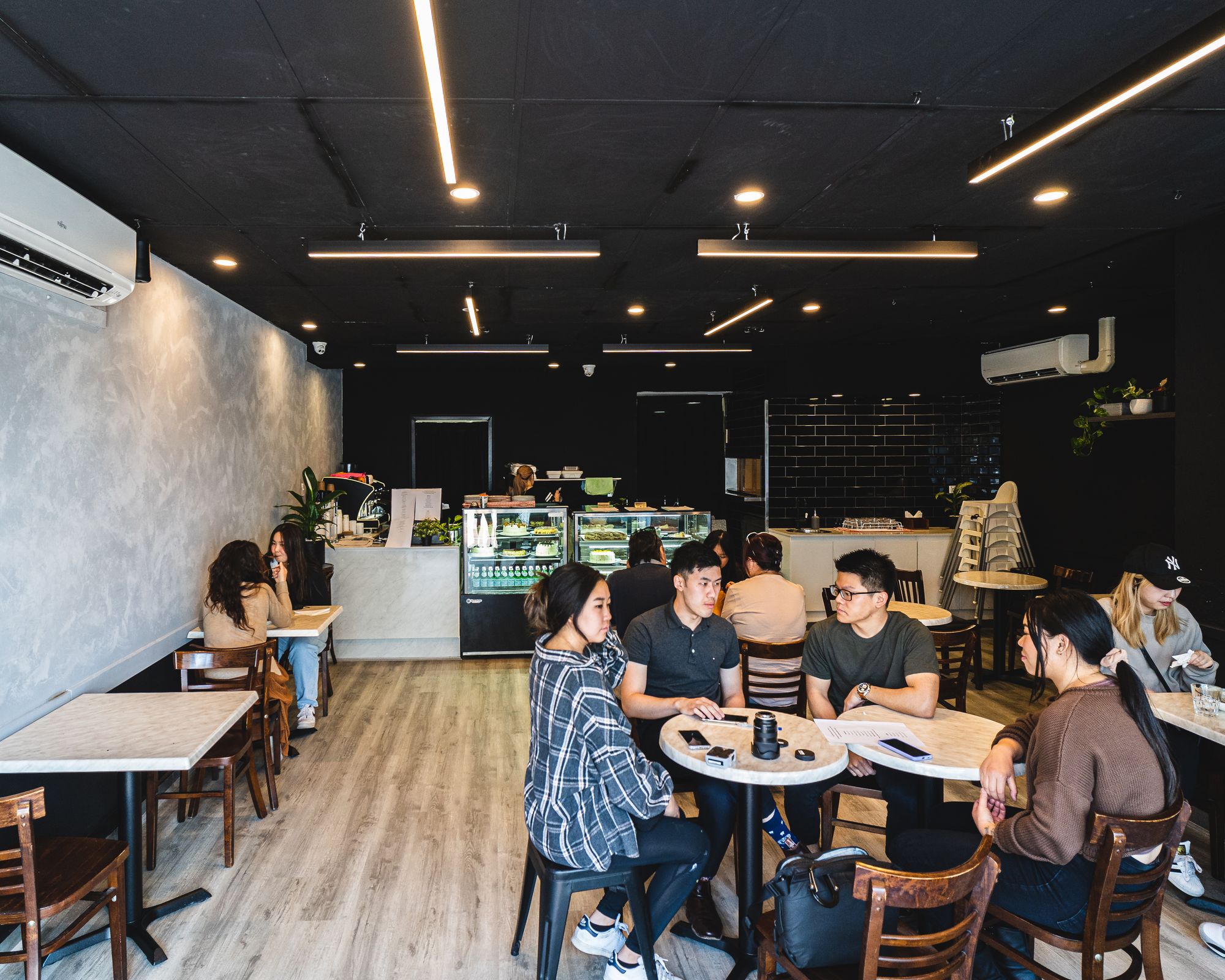 Guests dining inside of Momo Dessert Cafe