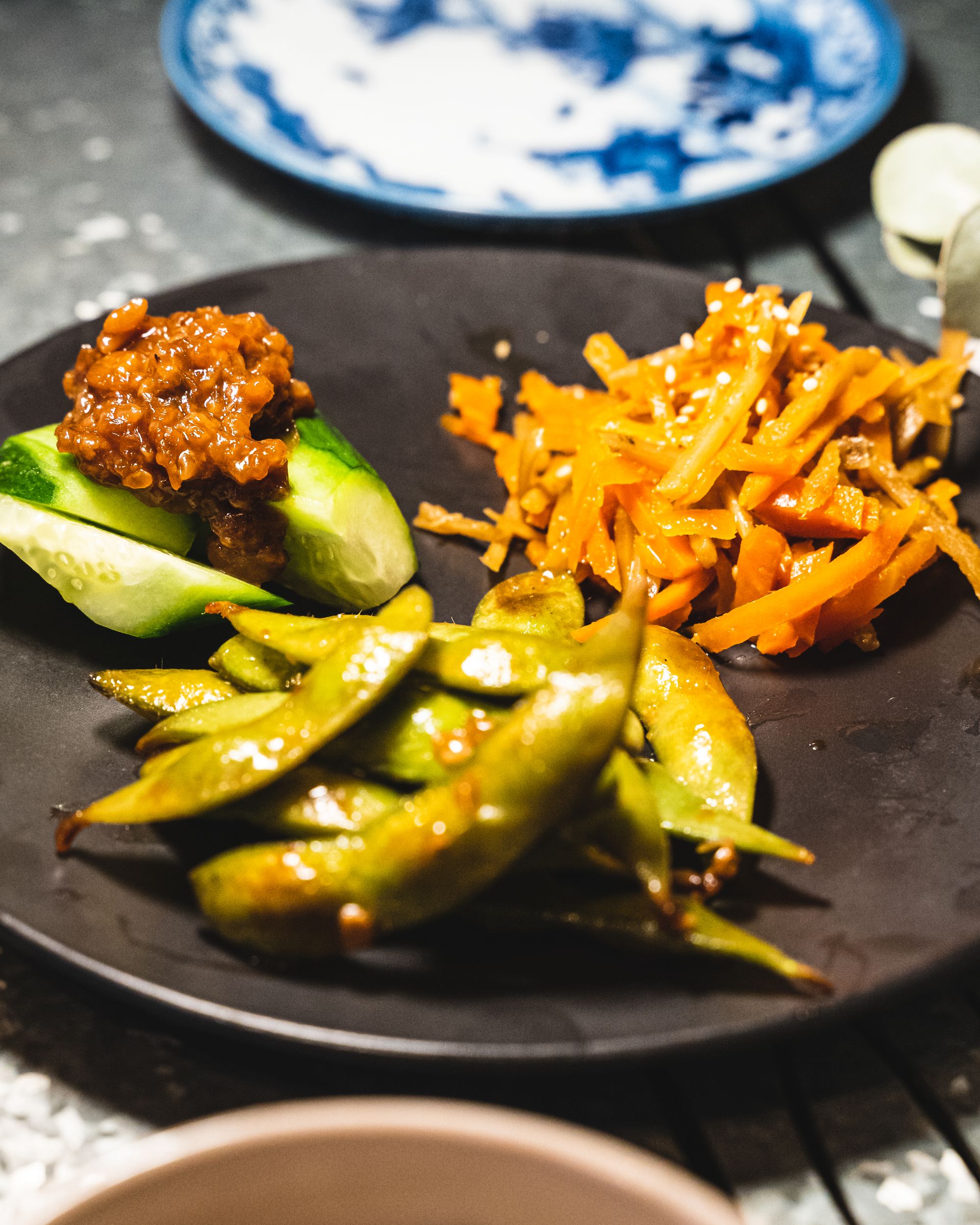 Edamame, cucumber with miso paste and burdock and carrot saute