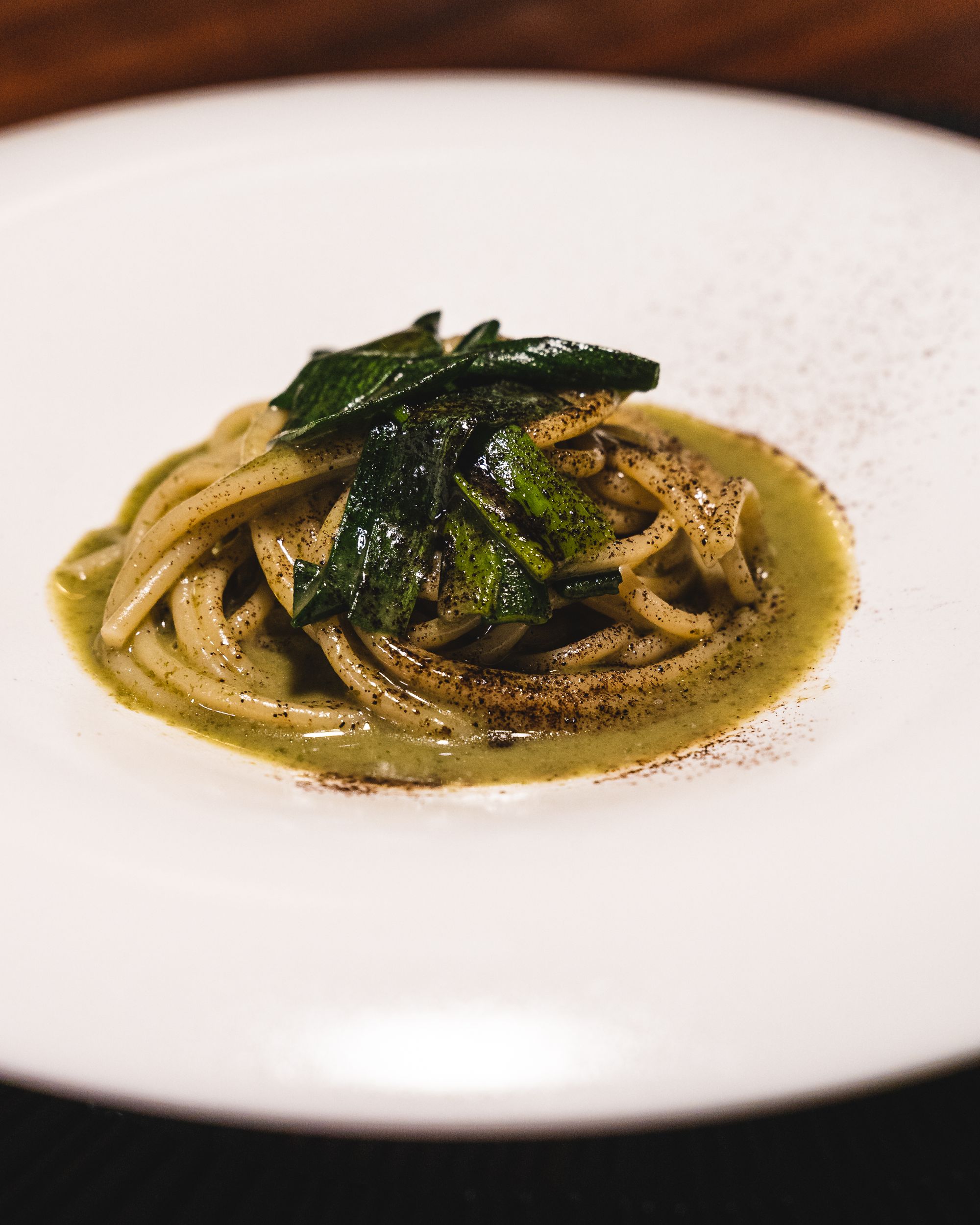 Close up of spaghetti with seaweed on top