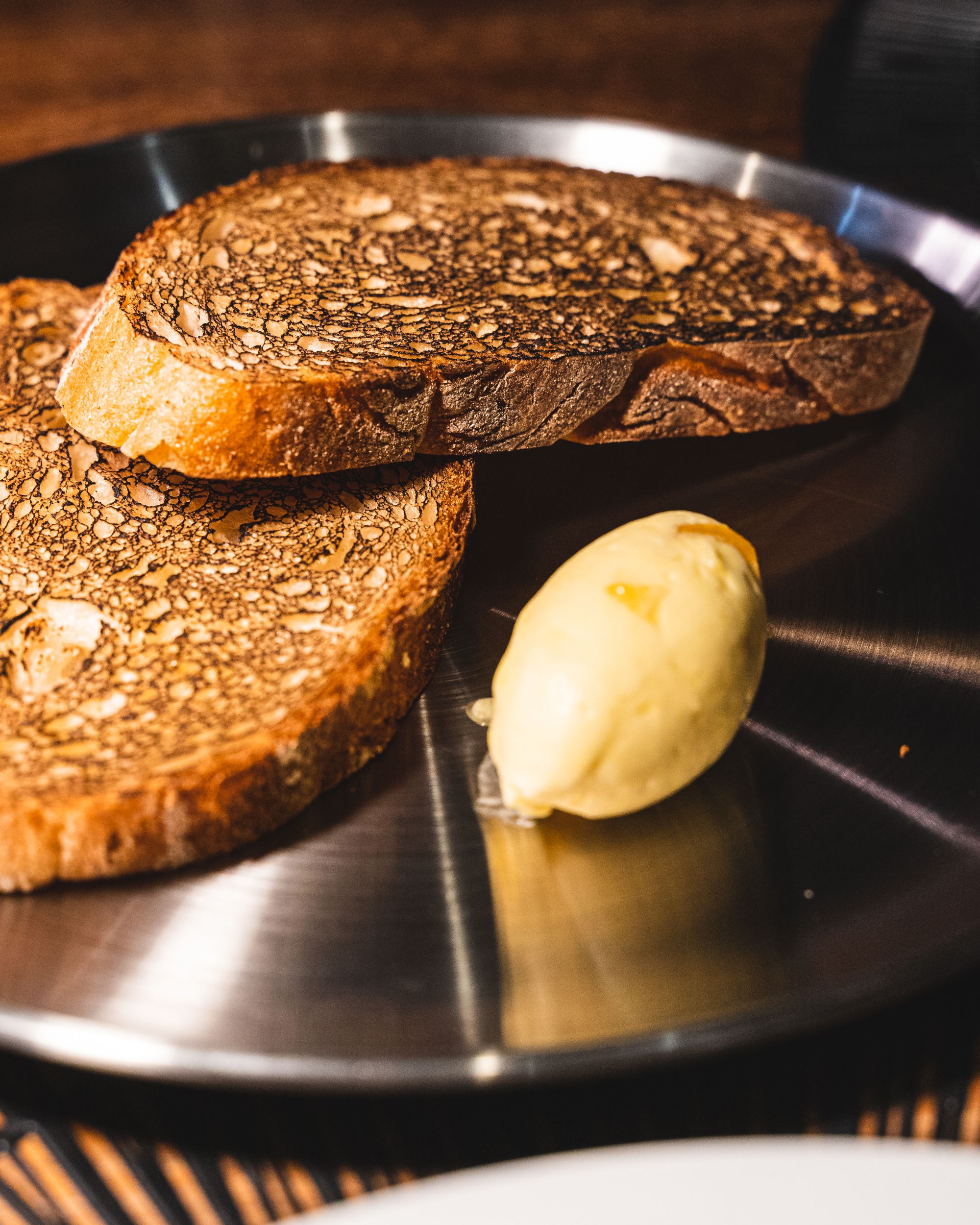 Close up of sourdough with a quenelle of butter 