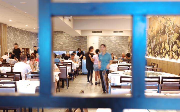 Interior of The Wang's Treasure House showing customers dining at their tables